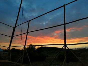 Silhouette landscape against sky during sunset