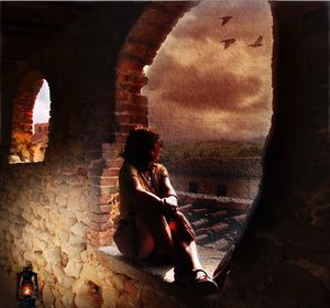 Women sitting on stone wall of historic building