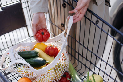 Cropped hand of man preparing food