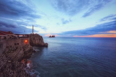 Scenic view of sea against sky at sunset