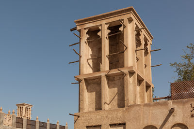 Low angle view of historical building against blue sky