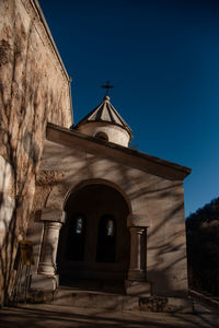 Low angle view of church against clear blue sky