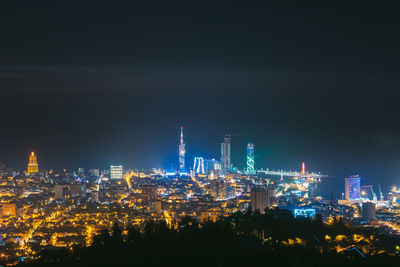 Illuminated buildings in city at night