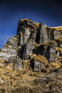 Low angle view of rock formation against clear sky