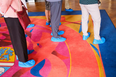 Low section of woman walking on floor