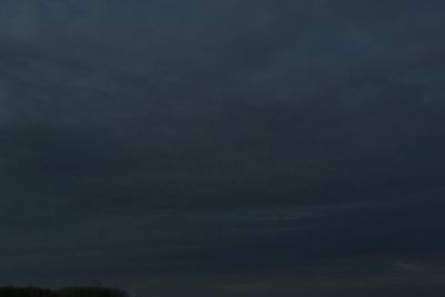 Low angle view of storm clouds at night