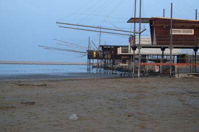 Lifeguard hut on beach against clear sky