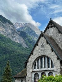 Houses and mountains against sky