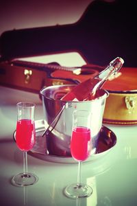 Close-up of wine glasses on table