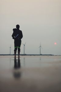 Distance shot of wind turbines on beach