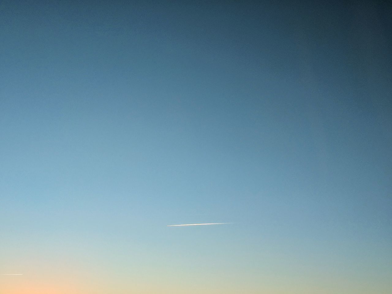 AIRPLANE FLYING IN CLEAR BLUE SKY