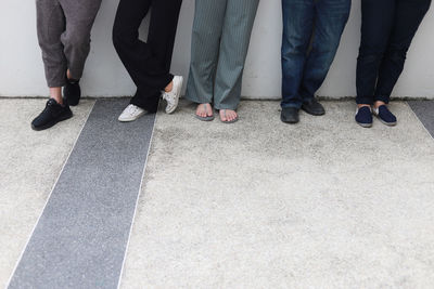Low section of people standing on floor