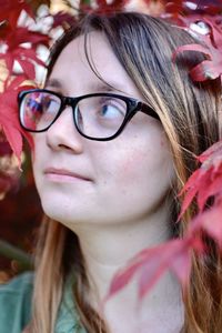 Close-up of young woman looking up