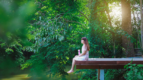 Woman sitting in a forest