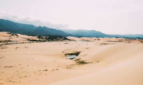 Scenic view of desert against sky