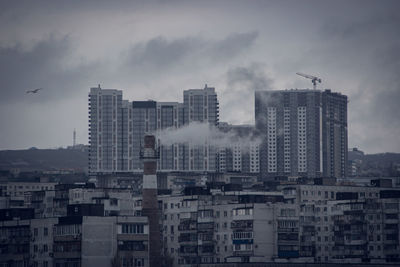 Buildings in city against sky