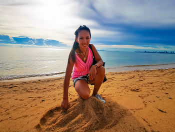 Portrait of pretty asian woman on beach