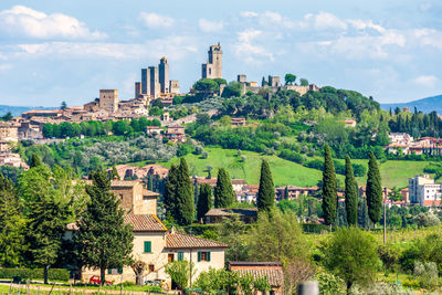 Landscape view of cultivated lands of tuscany with san gimignano and medieval towers in the distance
