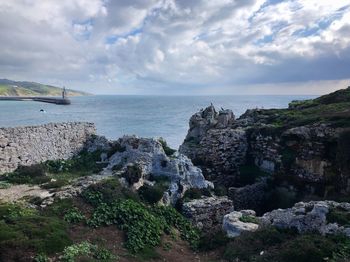 Scenic view of island and sea against sky