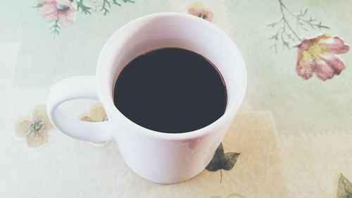 Directly above shot of coffee cup on table