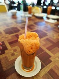 Close-up of drink served on table