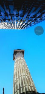 Low angle view of building against blue sky