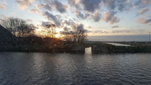 Scenic view of lake at sunset