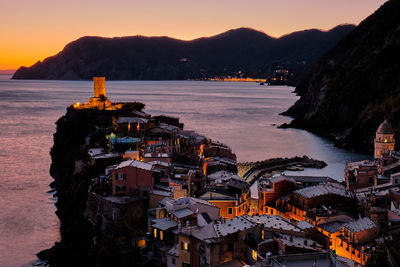 High angle view of townscape by sea