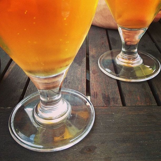 drink, food and drink, drinking glass, refreshment, freshness, table, indoors, alcohol, still life, glass - material, close-up, drinking straw, juice, transparent, glass, beer glass, cocktail, orange color, restaurant, wine