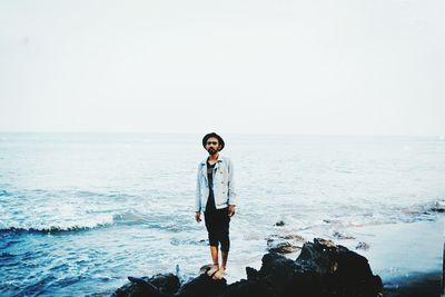 Woman standing on beach