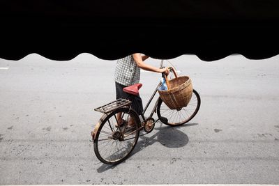 Man riding bicycle on road