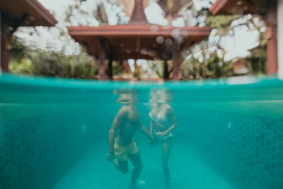 Man swimming in pool