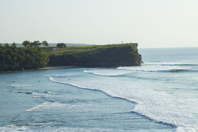Scenic view of beach against clear sky