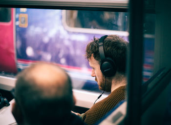 Blurred motion of people sitting in car