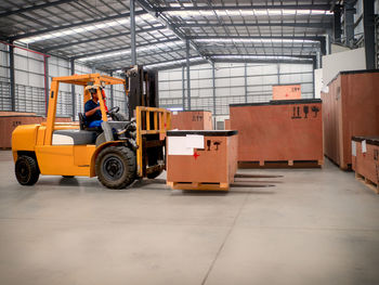 Rear view of man standing in factory