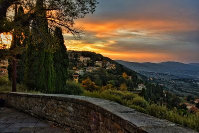 Scenic view of mountains against sky at sunset