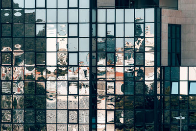 Reflection of buildings on glass window