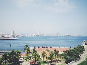 View of cityscape with river in foreground