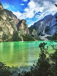 Scenic view of lake and mountains against sky