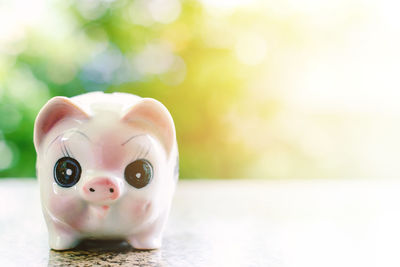 Close-up of piggy bank on table