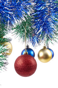 Close-up of christmas decorations hanging on tree