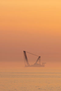 Heavy industry wind turbine installation barge off the dutch coast, building an offshore wind park 
