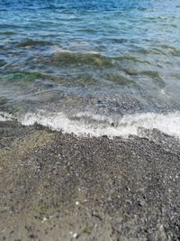 High angle view of waves rushing towards shore