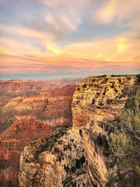 Scenic view of dramatic landscape against sky during sunset