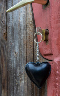 Close-up of key hanging on door