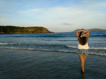 Rear view of woman at the seaside