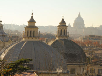 View of buildings in city against clear sky