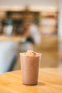 Chocolate smoothies milkshake on wood background