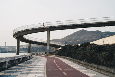 View of bridge over road against clear sky