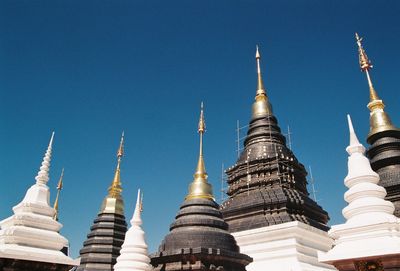 Low angle view of pagoda against blue sky